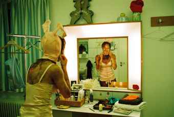 Munich Kammerspiele Backstage with Katharina Bach in a bunny costume looking in the mirror at Der Sturm