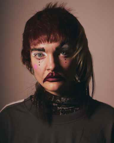 Sina Leinweber in clown makeup at the Otto-Falckenberg-Schule