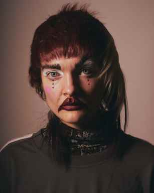 Sina Leinweber in clown makeup at the Otto-Falckenberg-Schule