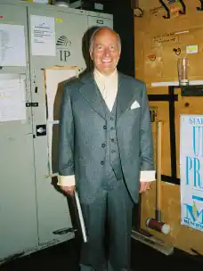 Munich Kammerspiele Stefan Merki grinning in costume backstage at Doping