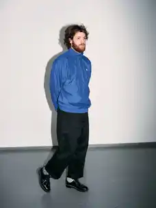 Portrait of Marlon Bienert with a blue jacket