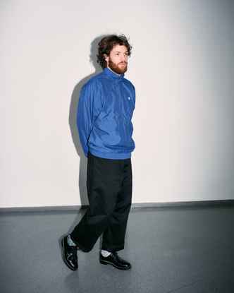 Portrait of Marlon Bienert with a blue jacket