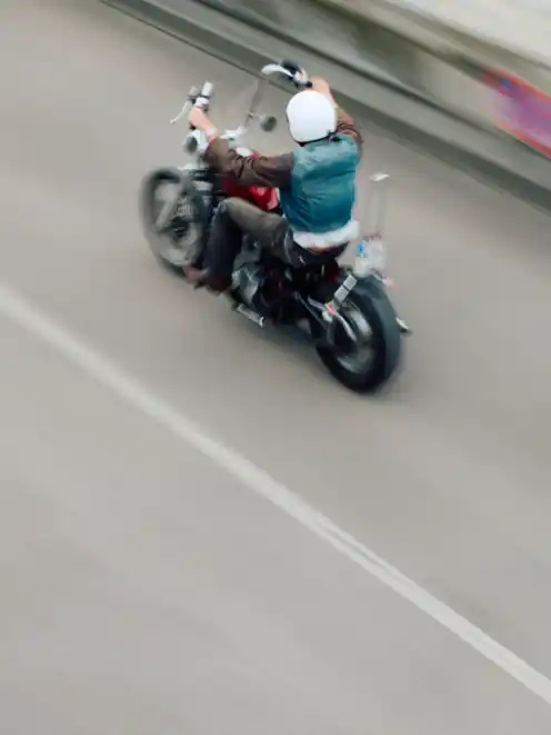 A biker passing into the distance from the project Elsewhere