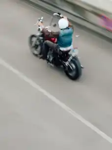 A biker passing into the distance from the project Elsewhere
